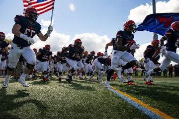 Football players hit the field.